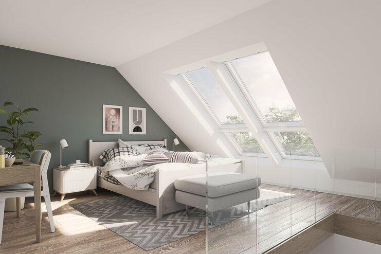 VELUX Dachfenster Impression eines Schlafzimmers mit einem weißen VELUX Dachfenster